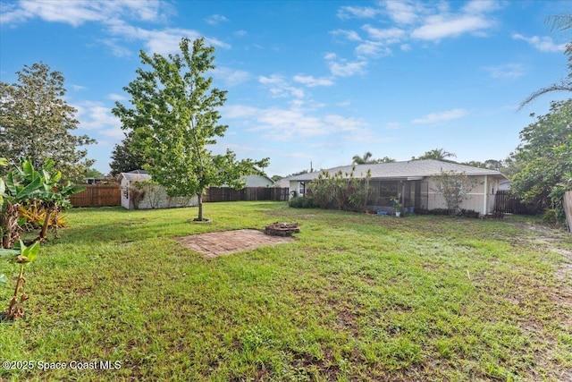 5970 Coker Ave, Cocoa, FL 32927 - view of yard with an outdoor fire pit and a sunroom