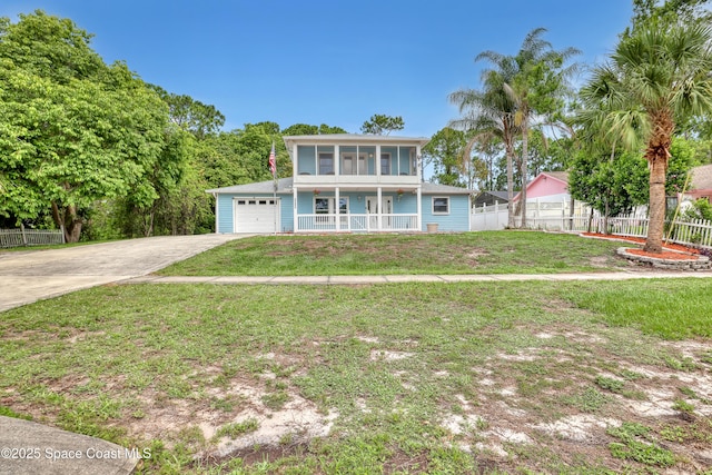 5280 Curtis Blvd, Cocoa, FL 32927 - view of front of property with driveway, an attached garage, and a sunroom