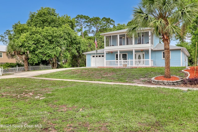 5280 Curtis Blvd, Cocoa, FL 32927 - view of front of property with driveway, covered porch, and a garage