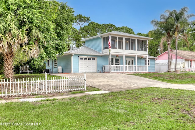 5280 Curtis Blvd, Cocoa, FL 32927 - view of front of property featuring a garage, concrete driveway, a sunroom, and covered porch