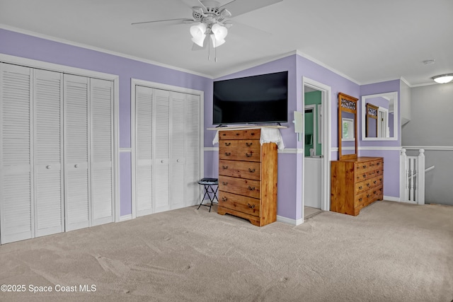 5280 Curtis Blvd, Cocoa, FL 32927 - bedroom with carpet floors, two closets, ornamental molding, a ceiling fan, and baseboards