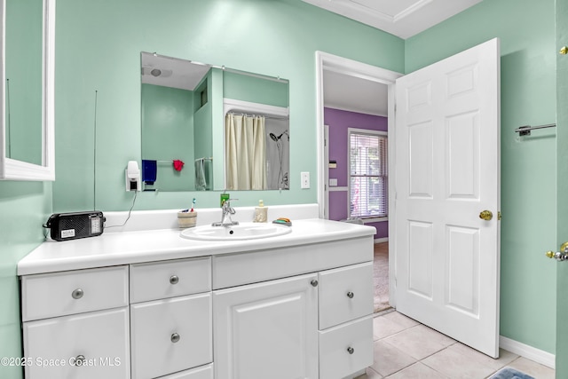 5280 Curtis Blvd, Cocoa, FL 32927 - bathroom featuring vanity, tile patterned floors, and baseboards