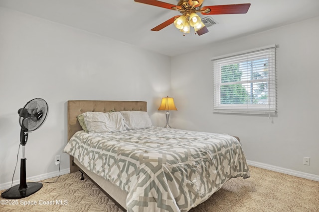 5280 Curtis Blvd, Cocoa, FL 32927 - bedroom with baseboards, carpet, and a ceiling fan