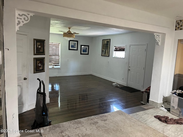 797 James Cir, Palm Bay, FL 32905 - foyer with a ceiling fan, wood finished floors, and baseboards