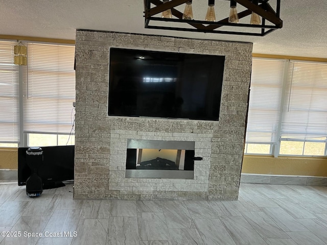 797 James Cir, Palm Bay, FL 32905 - detailed view of a textured ceiling, baseboards, and a fireplace