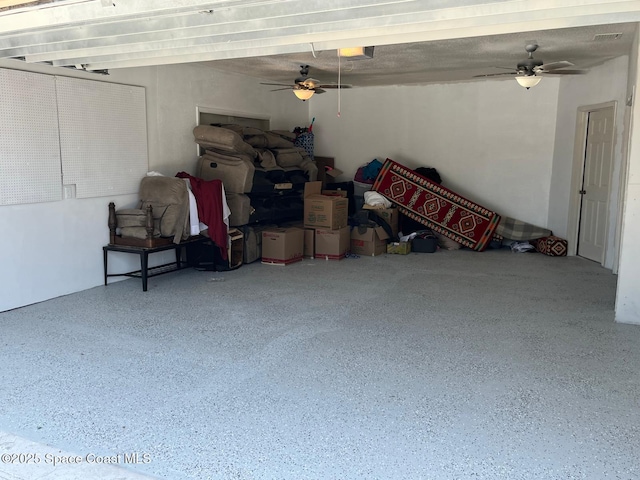 797 James Cir, Palm Bay, FL 32905 - garage with a ceiling fan and a garage door opener