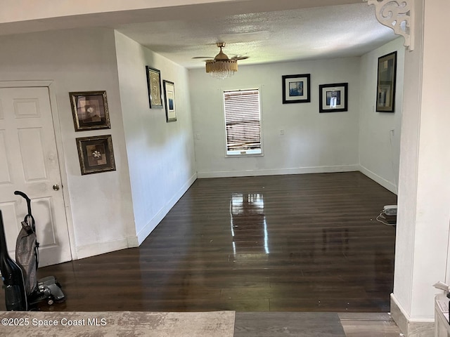 797 James Cir, Palm Bay, FL 32905 - unfurnished dining area with wood finished floors, a textured ceiling, and baseboards