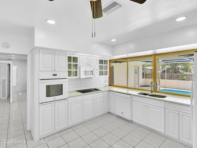 5118 Adams St, Hollywood, FL 33021 - kitchen featuring white appliances, a sink, ceiling fan, light countertops, and white cabinets