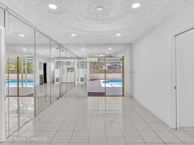 5118 Adams St, Hollywood, FL 33021 - unfurnished room with light tile patterned floors and recessed lighting