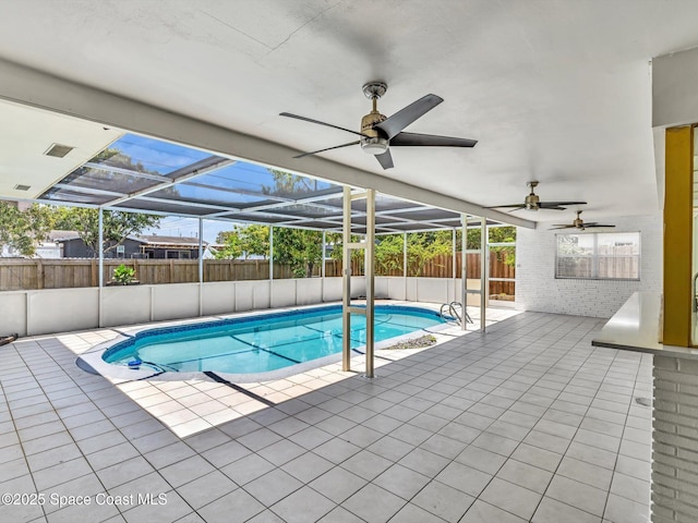 5118 Adams St, Hollywood, FL 33021 - view of swimming pool with a fenced backyard, a patio area, a fenced in pool, and a ceiling fan