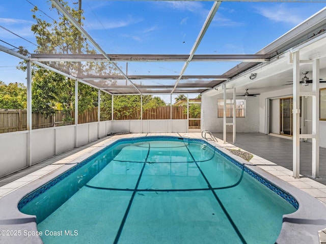 5118 Adams St, Hollywood, FL 33021 - view of pool featuring a patio, a ceiling fan, a fenced backyard, a fenced in pool, and glass enclosure