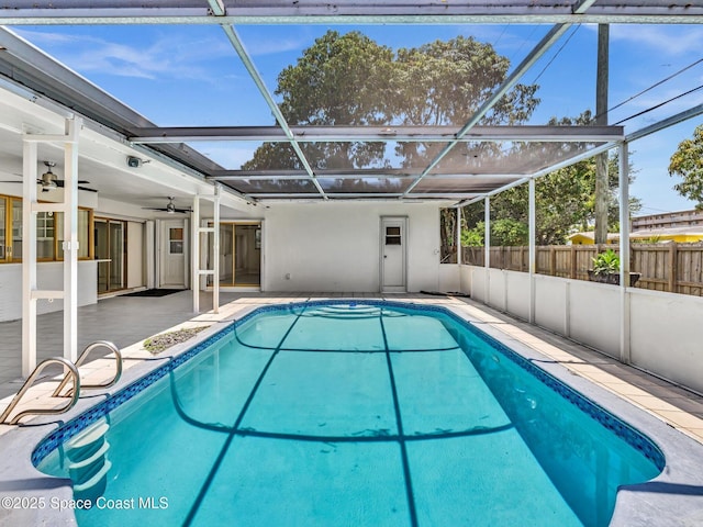 5118 Adams St, Hollywood, FL 33021 - view of swimming pool with fence, a ceiling fan, a patio, and glass enclosure