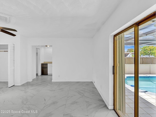 5118 Adams St, Hollywood, FL 33021 - interior space with baseboards, marble finish floor, and a ceiling fan
