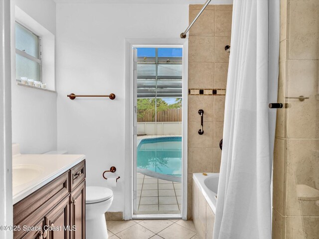 5118 Adams St, Hollywood, FL 33021 - full bath with tile patterned floors, toilet, tiled shower / bath, and vanity