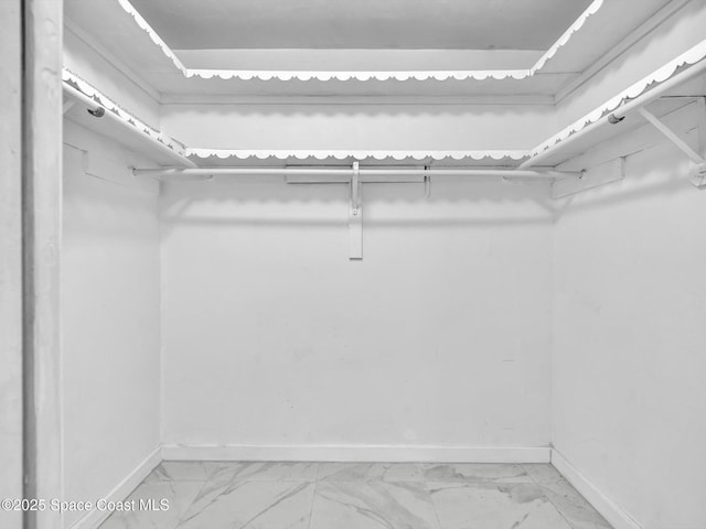 5118 Adams St, Hollywood, FL 33021 - walk in closet featuring light marble finish flooring