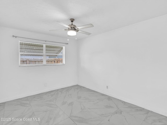 5118 Adams St, Hollywood, FL 33021 - unfurnished room with ceiling fan, marble look tiles, and baseboards