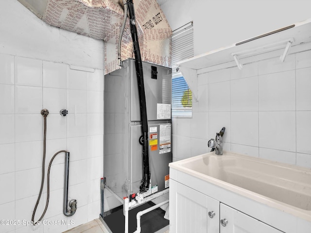 5118 Adams St, Hollywood, FL 33021 - utility room with water heater and a sink