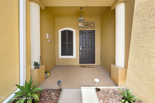 3202 Arden Cir, Melbourne, FL 32934 - entrance to property with stucco siding and a porch