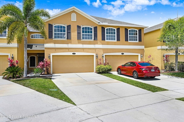 3202 Arden Cir, Melbourne, FL 32934 - view of front of property with stucco siding, concrete driveway, and an attached garage