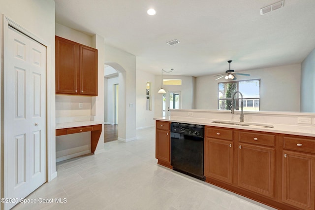 3202 Arden Cir, Melbourne, FL 32934 - kitchen with black dishwasher, a sink, arched walkways, a ceiling fan, and light countertops