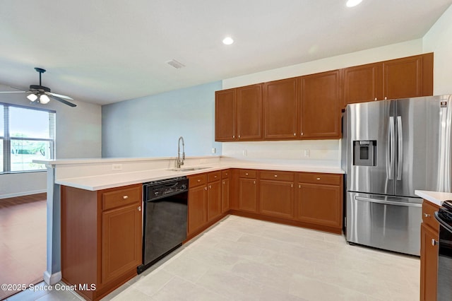 3202 Arden Cir, Melbourne, FL 32934 - kitchen featuring stainless steel fridge, black dishwasher, a sink, light countertops, and a peninsula
