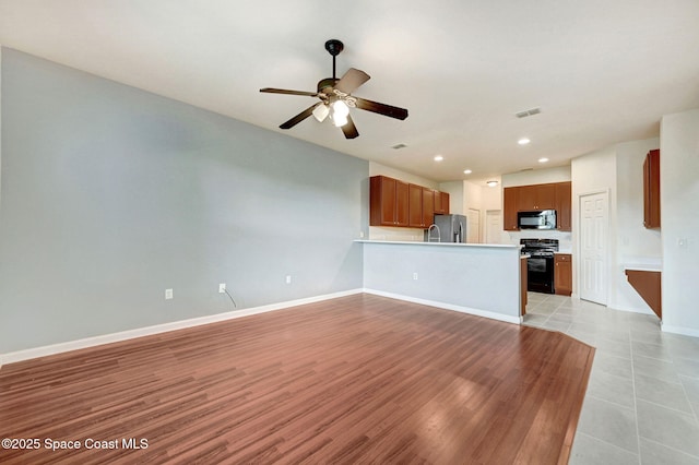 3202 Arden Cir, Melbourne, FL 32934 - unfurnished living room with a ceiling fan, recessed lighting, baseboards, and light wood-style floors