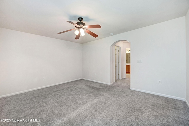 3202 Arden Cir, Melbourne, FL 32934 - spare room featuring arched walkways, ceiling fan, light colored carpet, and baseboards