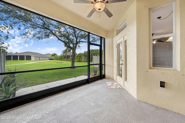 3202 Arden Cir, Melbourne, FL 32934 - unfurnished sunroom featuring a ceiling fan and a residential view