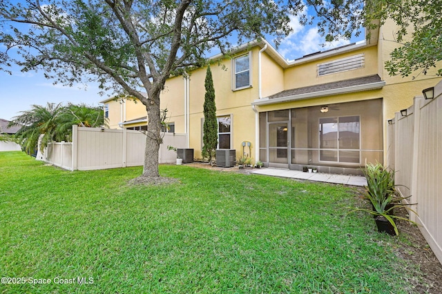 3202 Arden Cir, Melbourne, FL 32934 - back of house featuring stucco siding, a sunroom, and central AC