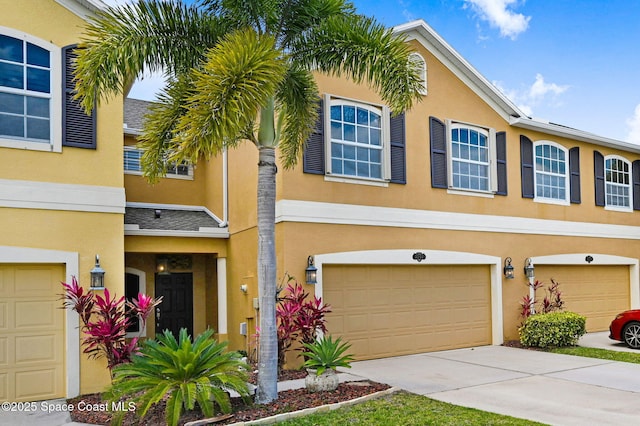 3202 Arden Cir, Melbourne, FL 32934 - view of front of property with a garage, stucco siding, and concrete driveway