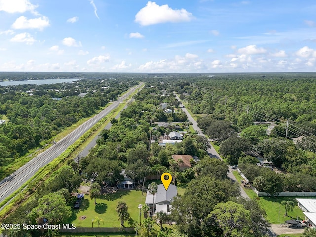 9633 Honeysuckle Dr, Sebastian, FL 32976 - bird's eye view featuring a water view and a forest view