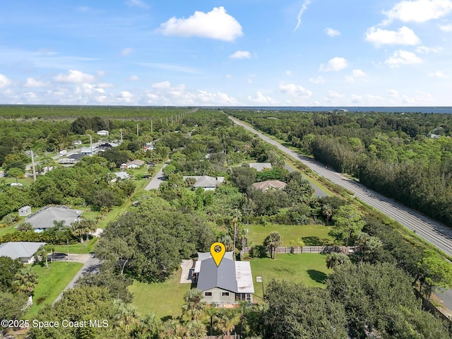 9633 Honeysuckle Dr, Sebastian, FL 32976 - aerial view featuring a forest view