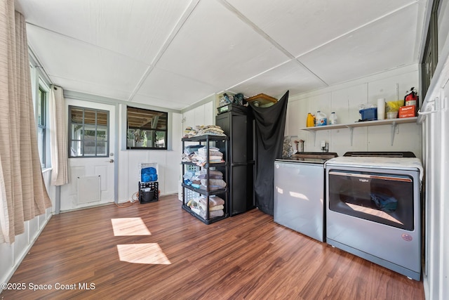 9633 Honeysuckle Dr, Sebastian, FL 32976 - washroom featuring separate washer and dryer and wood finished floors