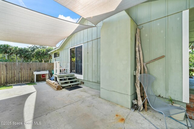 9633 Honeysuckle Dr, Sebastian, FL 32976 - view of patio / terrace with fence