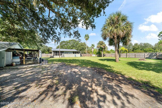 9633 Honeysuckle Dr, Sebastian, FL 32976 - view of yard with fence