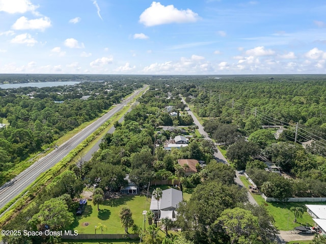 9633 Honeysuckle Dr, Sebastian, FL 32976 - aerial view with a wooded view and a water view