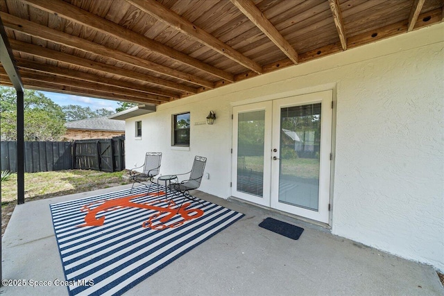 view of patio with fence and french doors