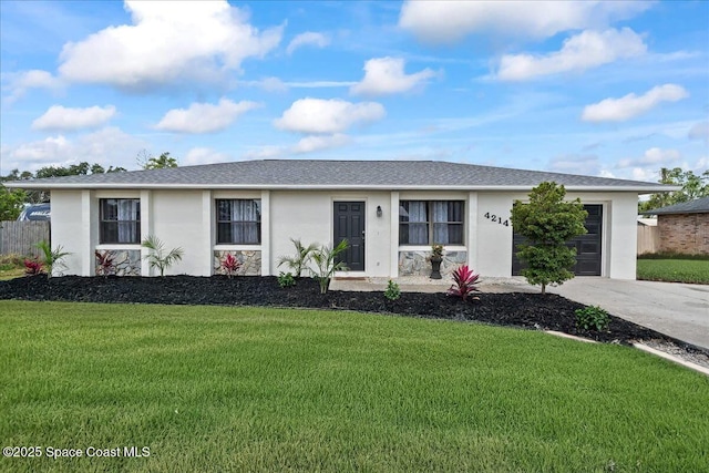 ranch-style home with stucco siding, an attached garage, concrete driveway, and a front yard
