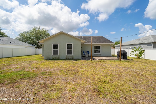 1265 Giralda Cir NW, Palm Bay, FL 32907 - rear view of house featuring a patio and stucco siding