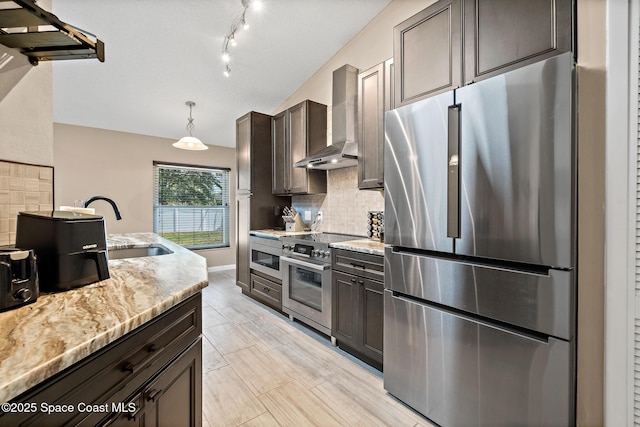 1265 Giralda Cir NW, Palm Bay, FL 32907 - kitchen featuring stainless steel appliances, wall chimney exhaust hood, a sink, backsplash, and dark brown cabinetry