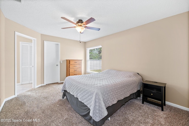 1265 Giralda Cir NW, Palm Bay, FL 32907 - carpeted bedroom with ceiling fan, baseboards, and a textured ceiling