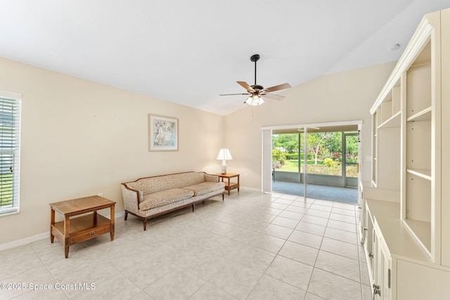 7175 Mendell Way, Melbourne, FL 32940 - living area with ceiling fan, baseboards, light tile patterned floors, and lofted ceiling