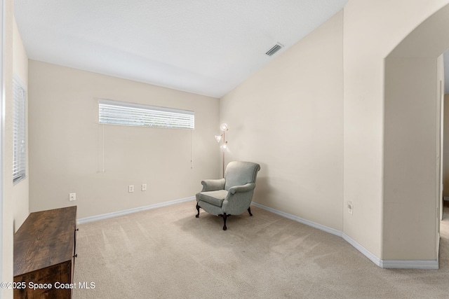 7175 Mendell Way, Melbourne, FL 32940 - unfurnished room with carpet floors, arched walkways, baseboards, and lofted ceiling