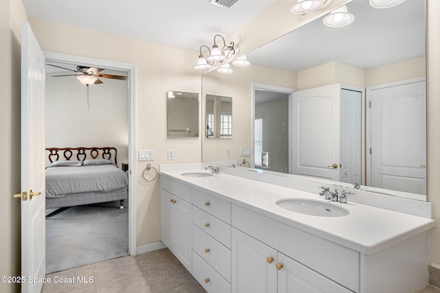 7175 Mendell Way, Melbourne, FL 32940 - ensuite bathroom featuring ceiling fan, double vanity, baseboards, and tile patterned floors