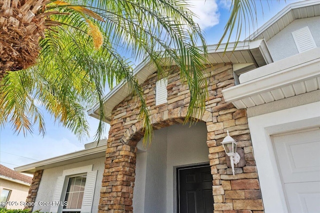 view of side of property featuring stone siding