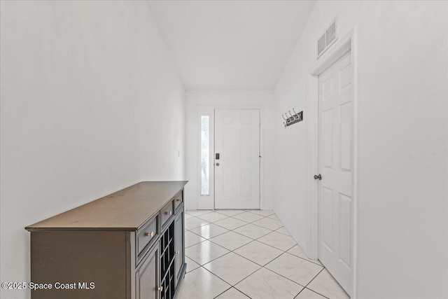 entryway featuring light tile patterned floors