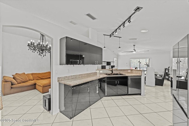 kitchen featuring stainless steel dishwasher, a sink, ceiling fan, a peninsula, and open floor plan