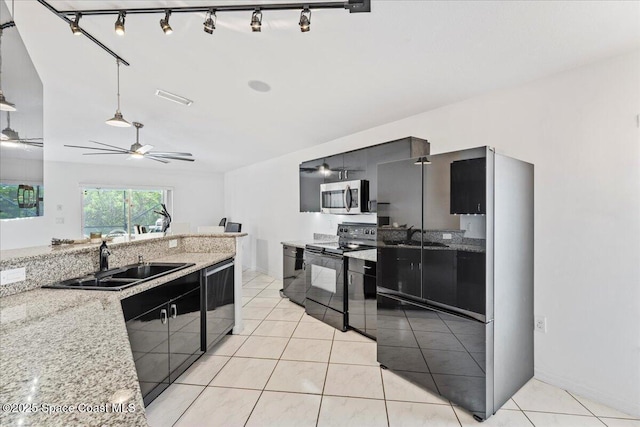 kitchen featuring black appliances, a sink, a ceiling fan, and light tile patterned flooring