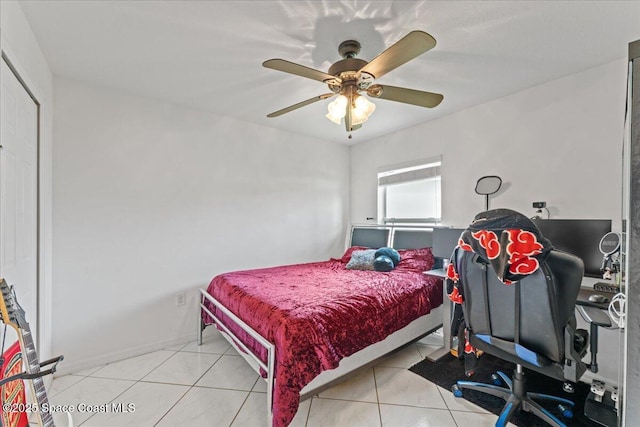 bedroom with ceiling fan and light tile patterned floors