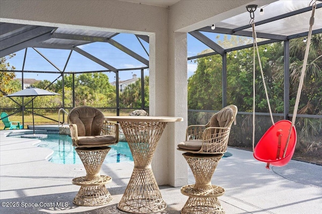 view of patio with an outdoor pool and a lanai